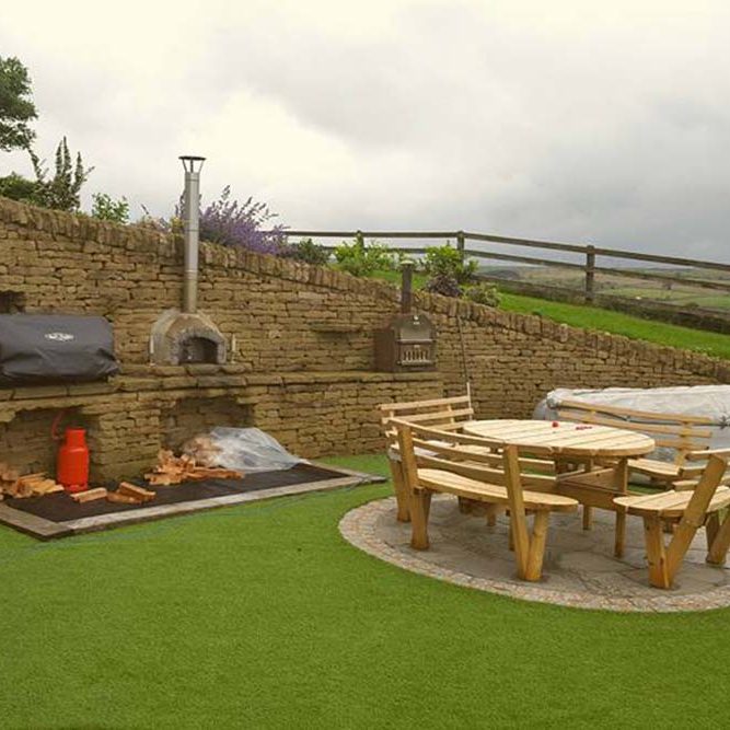 Outdoor seating area with stone BBQ area